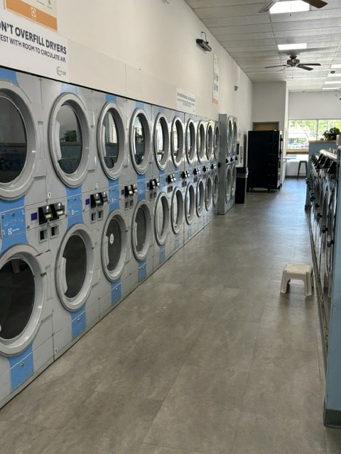 Stacked dryers inside Scrubs Laundry